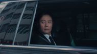 The Front Man looks out of the window to spot a recruiter in Los Angeles (Image via Netflix)
